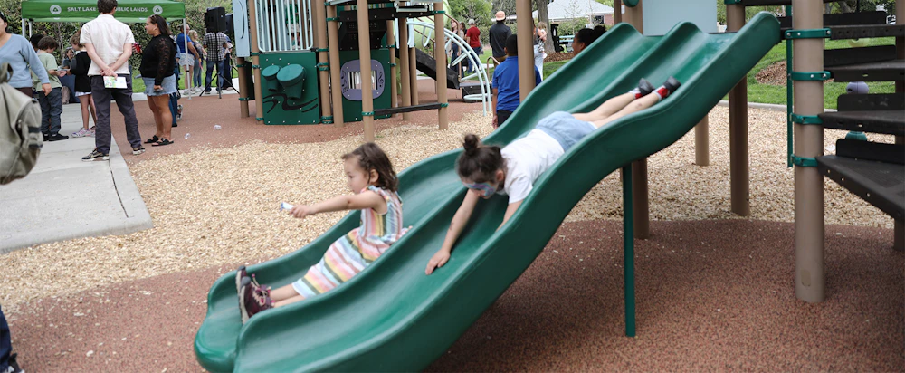 Kids test out the new slides and other play equipment