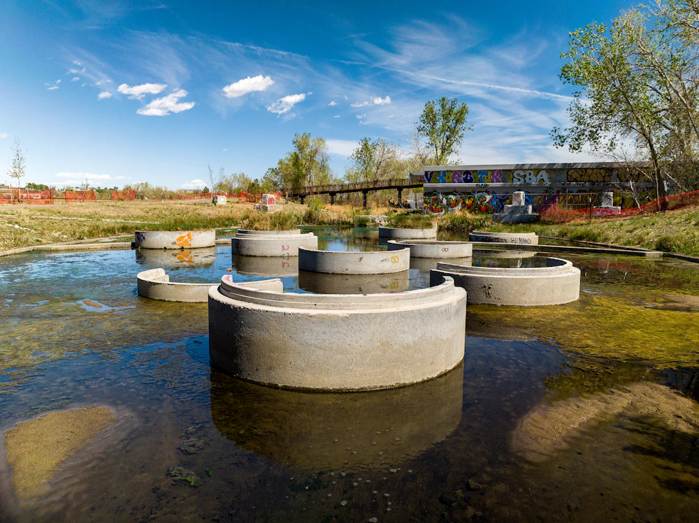 Stormwater infrastructure becomes a visible and educational landscape feature—improving water quality while shaping experience