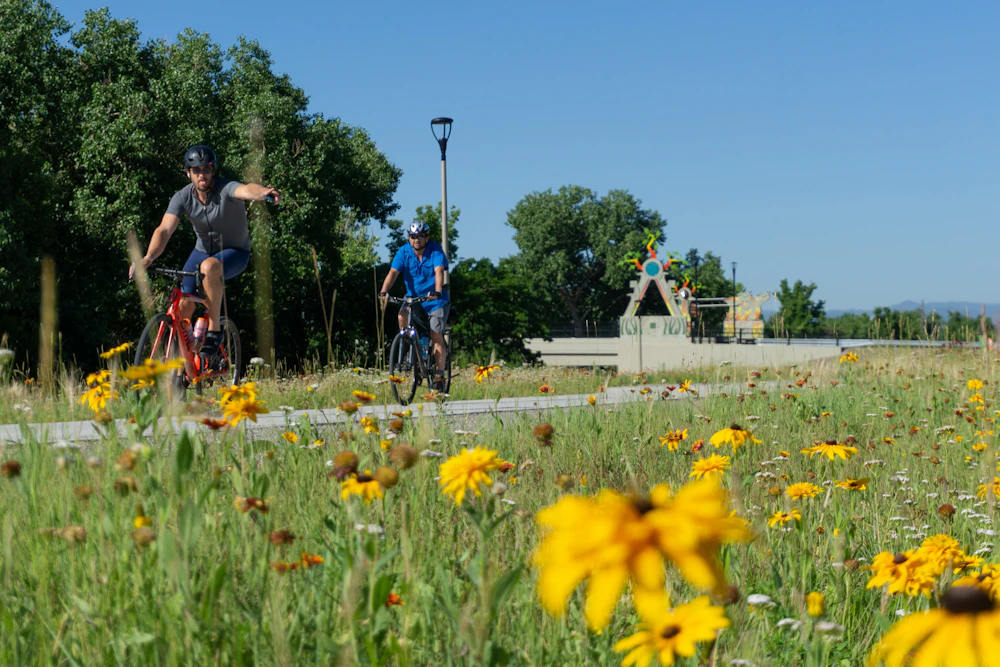 A continuous network of trails, overlooks, and gathering spaces connects people to the river and to each other