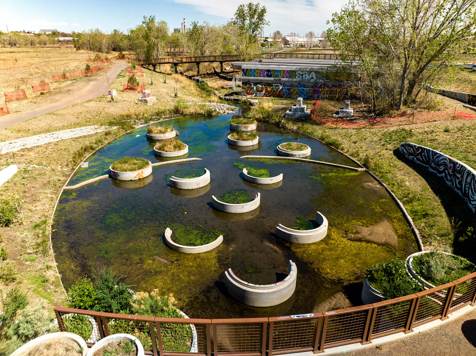 Stormwater infrastructure becomes a visible and educational landscape feature—improving water quality while shaping experience.