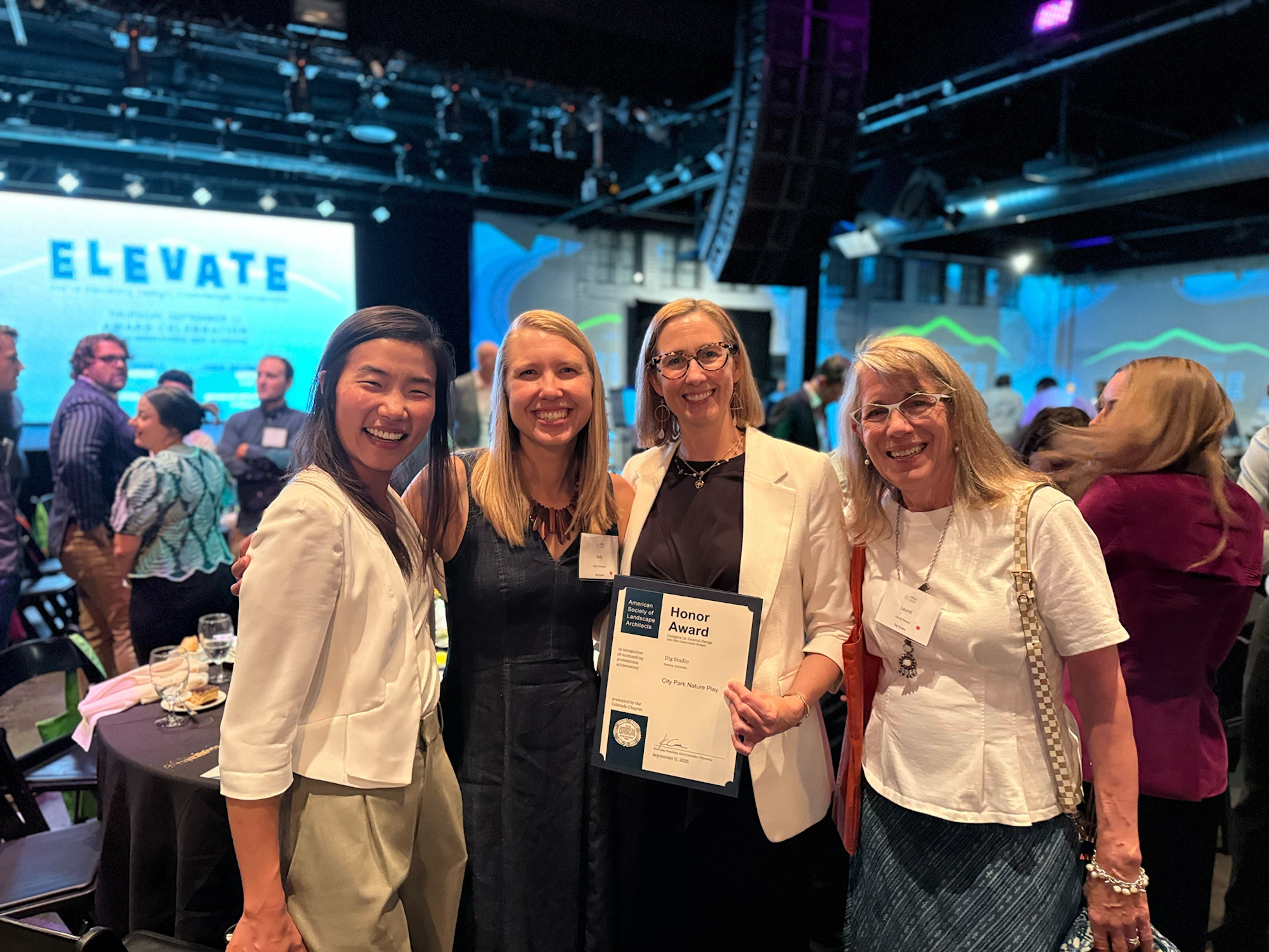 Dig Studio team members gather for a photo with the Honor Award for City Park Nature Play.